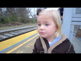 the reaction of a 3-year-old girl to the train