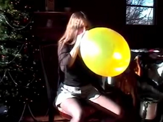 alena squeeze to pop a yellow balloon