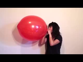 cute girl bursting large punch balloon