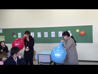 japanese girls terrorize classroom with blow to pop of large balloons